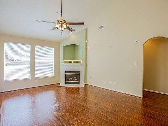 Two story living room with a beautiful corner fireplace!
