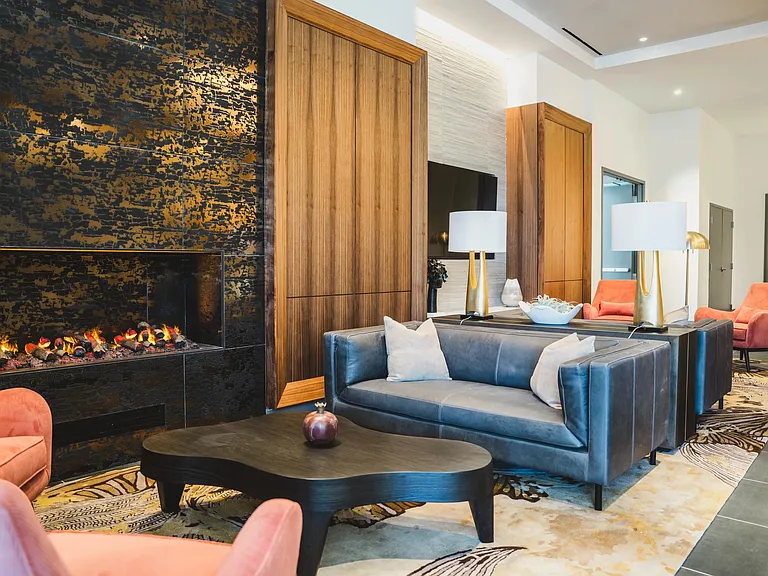 30th-floor lounge room with comfortable seating and fireplace.