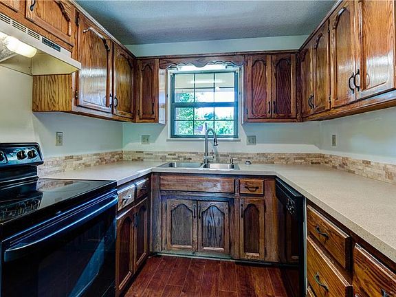 Kitchen with lots of cabinets and counter space. Appliances: Range, DW, Refrigerator, Garbage Disposal