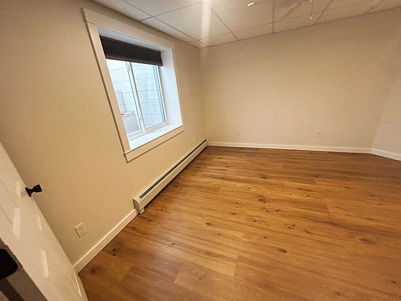 Large bedroom with window. (View from entrance from the living room.)