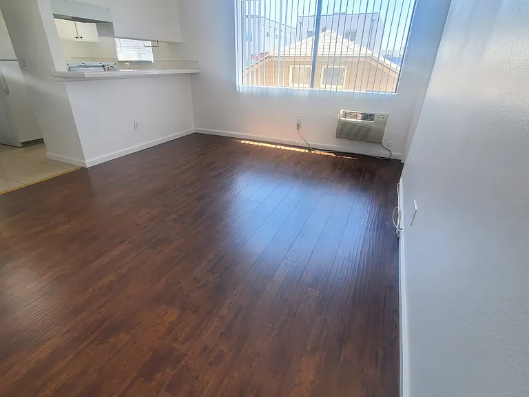 SPACIOUS LIVING ROOM WITH LARGE WINDOW FOR LOTS OF LIGHT