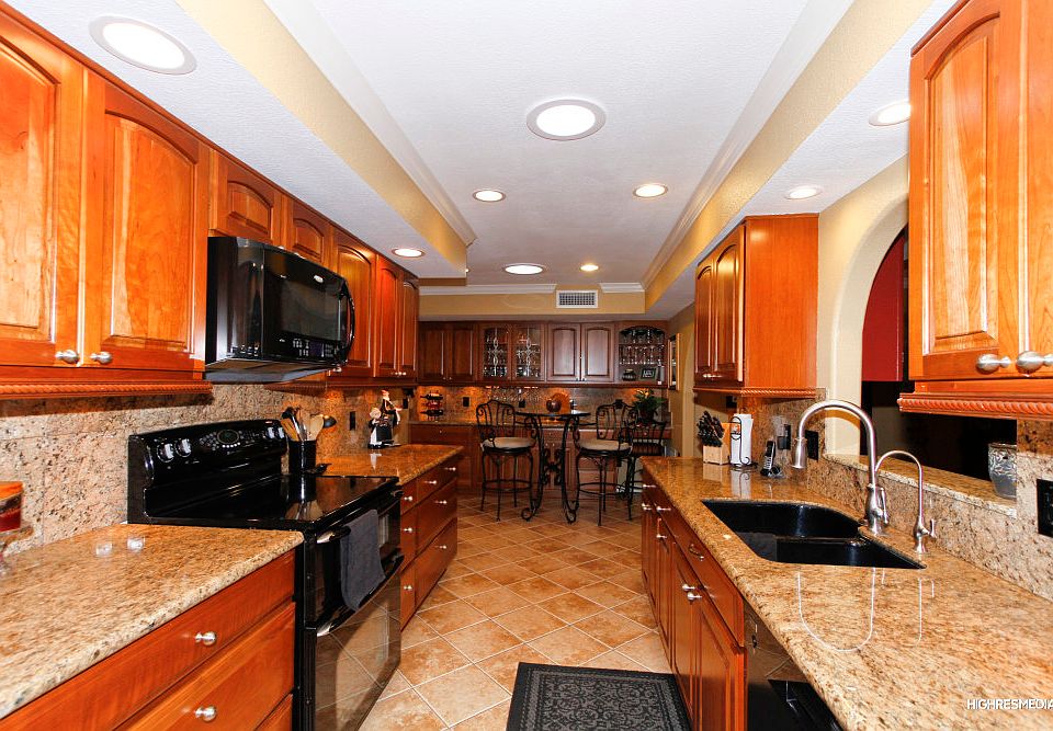 Look out in to the living room while standing at the Kitchen Sink.