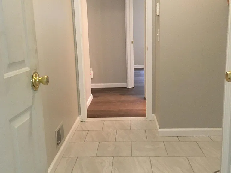 View from garage entry. Picture from 2019. Washer and dryer have been installed.