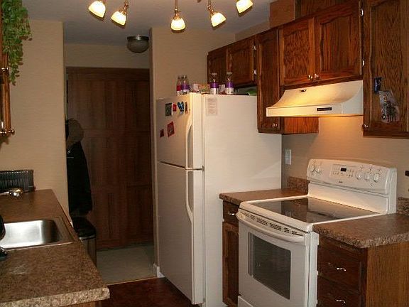 Kitchen features Oak Cabinetry, New Hardware, Newer Appliances & New Counters!