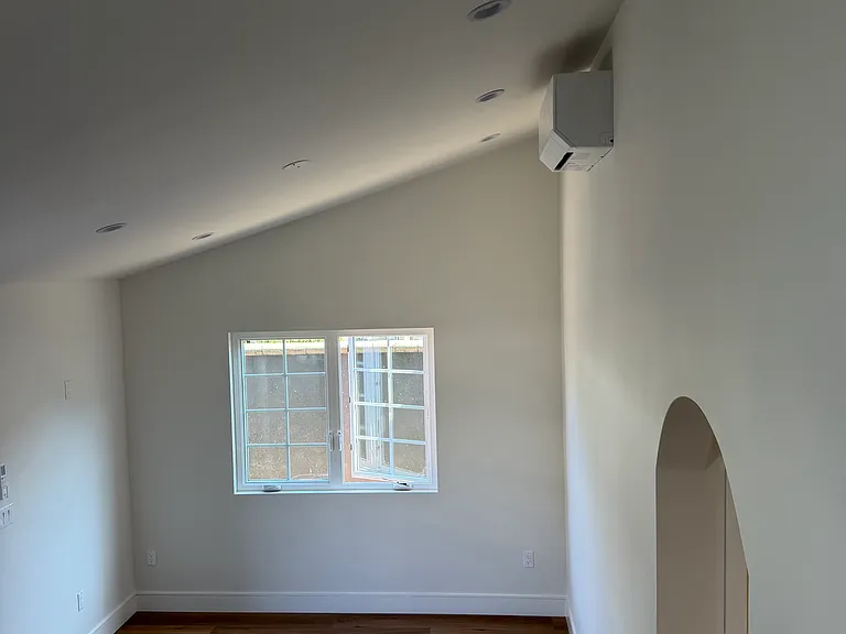 living room with vaulted ceilings and mini-split heating & air conditioning