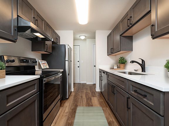 Experience culinary delight in this sleek and modern kitchen designed for functionality and style.