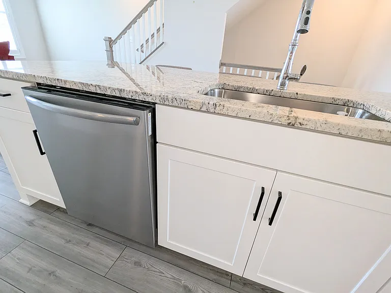Dishwasher and white cabinets