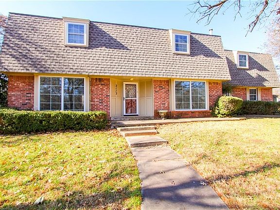 Another view front view of this beautiful one owner home nestled on a corner lot (almost one full acre) with mature trees in NE Edmond.