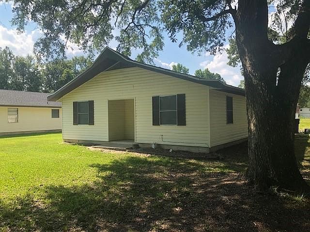 Huge yard with shade trees; yard is maintained by owner.