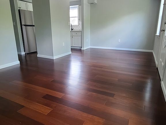 Spacious living / dining area; new hardwood floors throughout