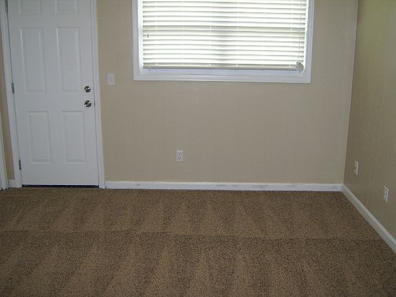 bedroom big enough for a queen bed with full dresser and roo