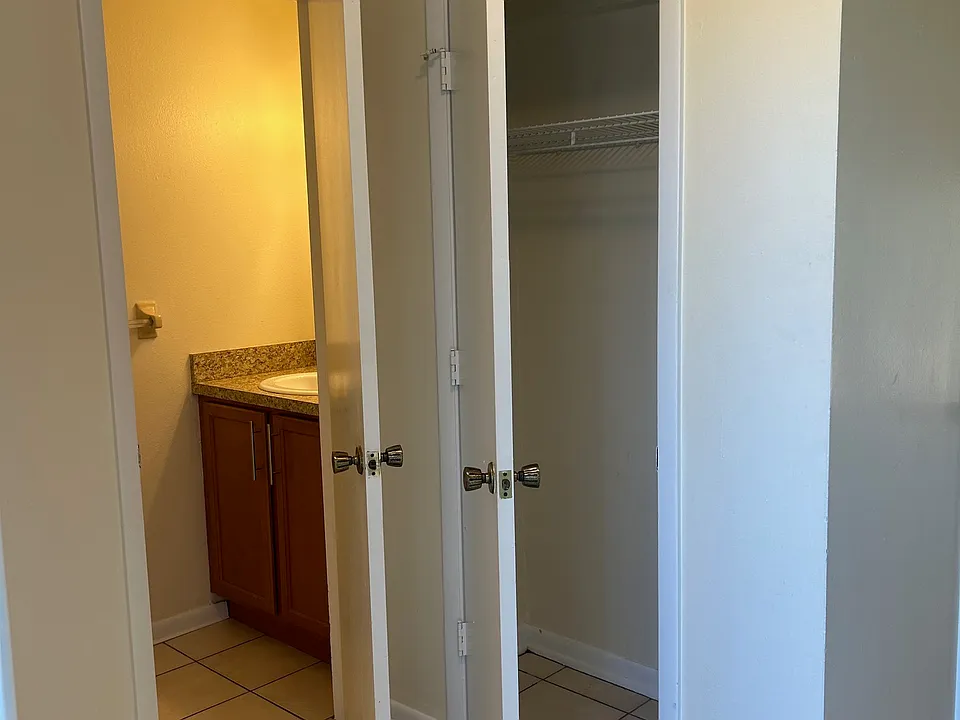Coming in front door: half bath and coat closet