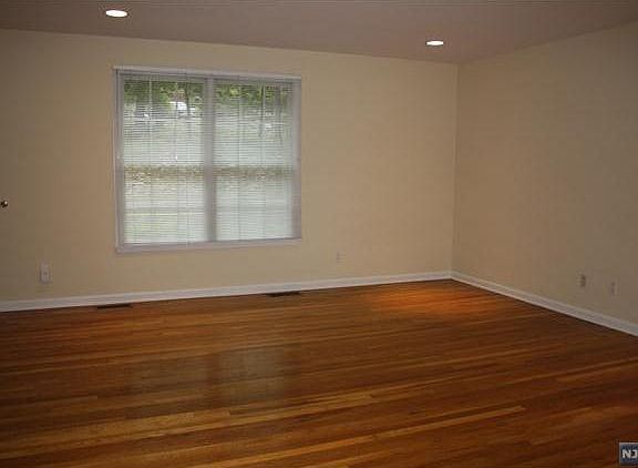 Spacious bedroom with Beautiful Hardwood Floors