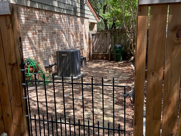 Large side yard, great for storage or pet area as needed.
