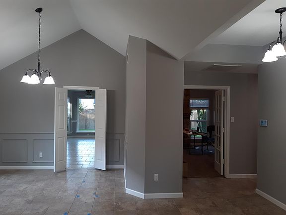 from just inside the front door. Dinning area on the left. Den is through the double doors on the right