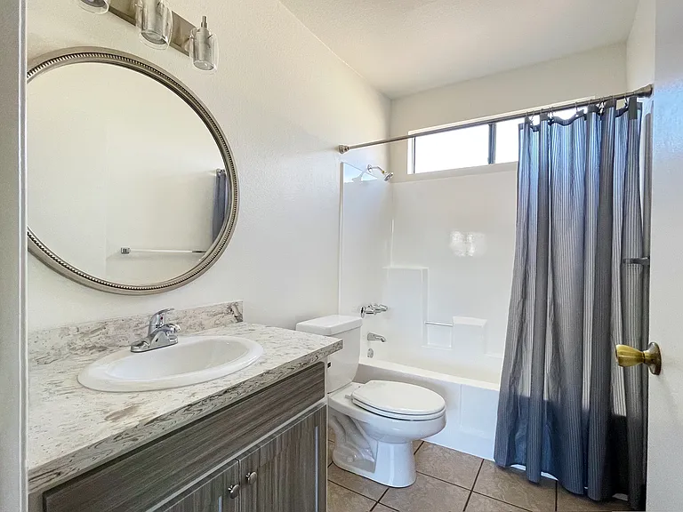 Beautifully renovated bathrooms with quartz counters and customized decor