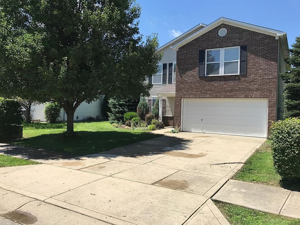 Two car garage and driveway parking.