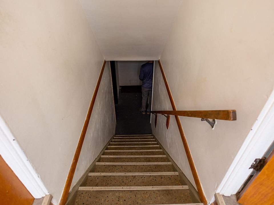 Stairs to laundry room and 3rd bedroom