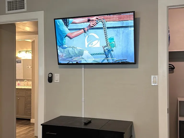 TV and desk in second bedroom