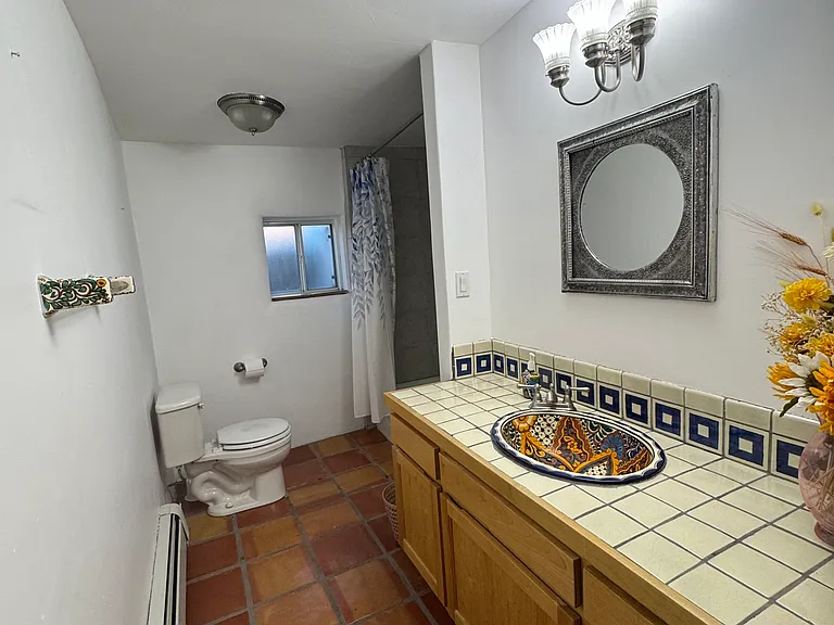 Master bath, custom wood cabinets & mexican tile