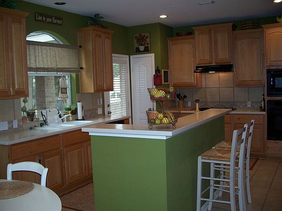 Huge kitchen with tons of cabinet space and corian counters