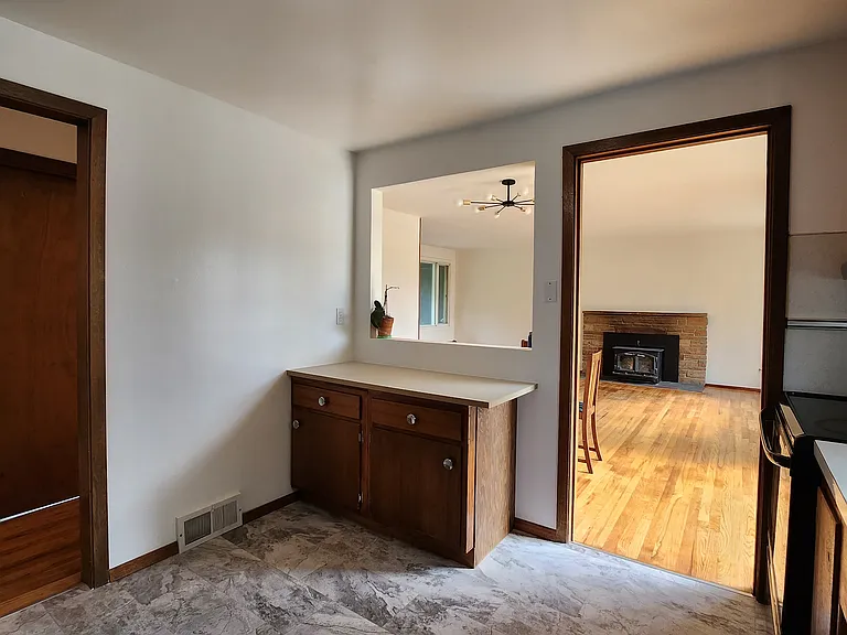 From kitchen looking out towards the living room. Coffee/appliance nook/prep space with newer countertop.