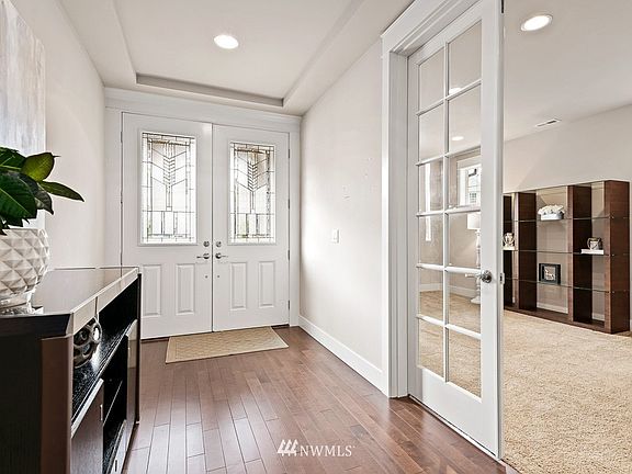 French doors open to a spacious main floor den/office.