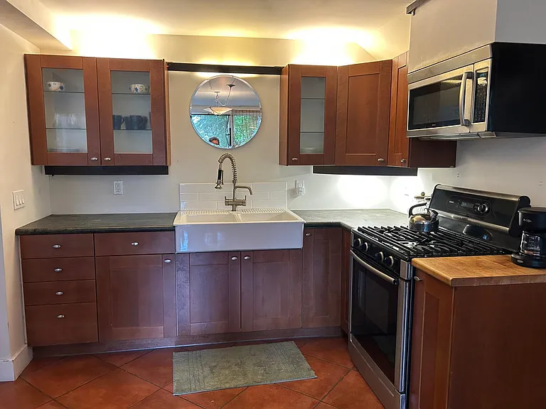 Full kitchen, gas range, microwave, double sink, drawers, cabinets, under sink storage