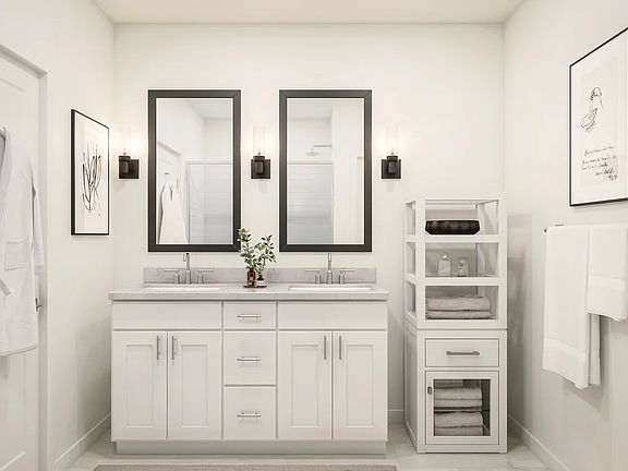 Primary bath with black-framed mirrors