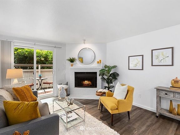Living room with wood fireplace.  
