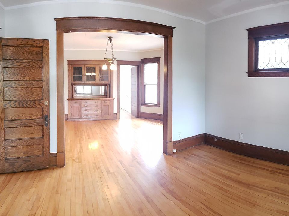 The size, the light, the hardwoods and FLOW make this apartment feel and work like a home. View from inside living room and entry area into dining, and kitchen beyond on far right top.
