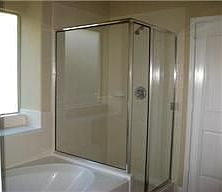 Master bath has elongated commode, garden tub and shower. Tile flooring.. birch cabinetry.. stained 