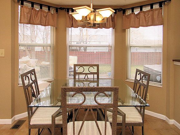 The kitchen gets plenty of natural light from the bay windows.