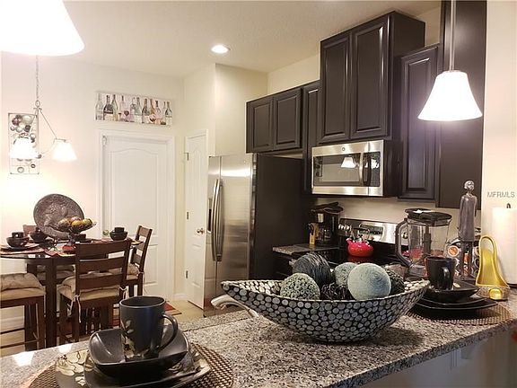Eat in kitchen with extended granite breakfast bar.