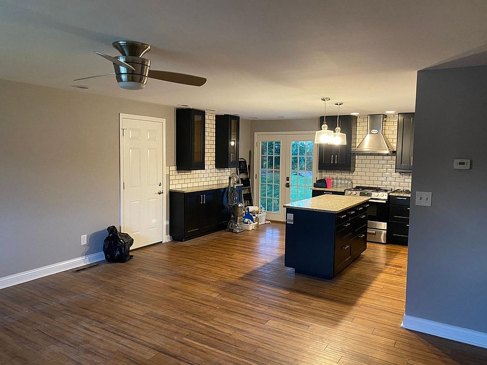Inside front door looking into living room and kitchen