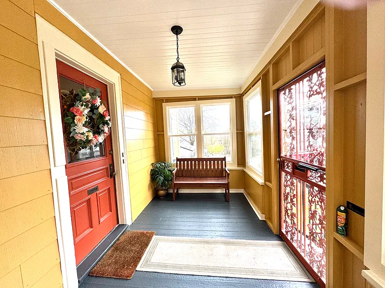 This is the front porch entrance that leads to the front hallways that lead to the private entrance to each apartment.