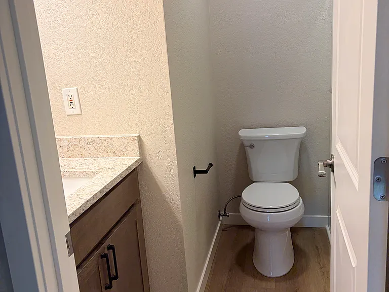 Upstairs full bath (new cabinet, sink, toilet, mirror, lighting, etc.)