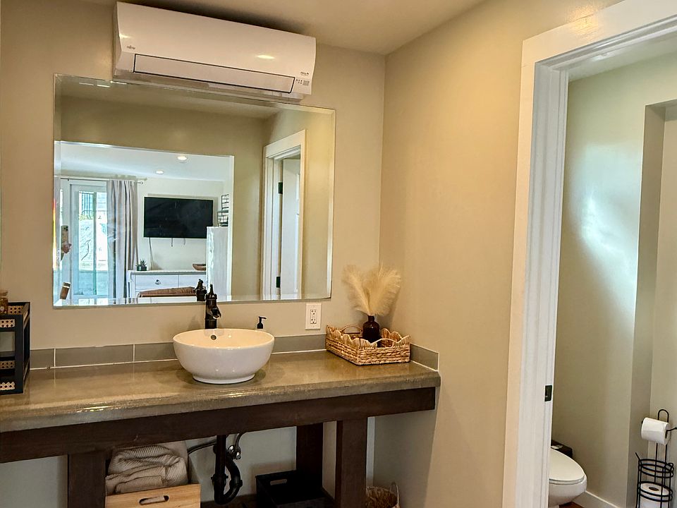 Vanity sink and bathroom door entrance.
