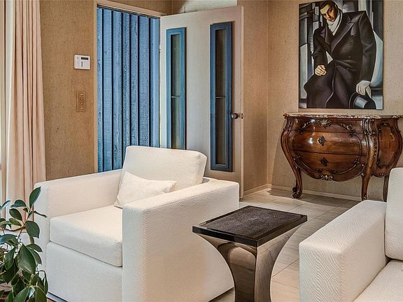 View looking at entry foyer, featuring expansive marble floors.