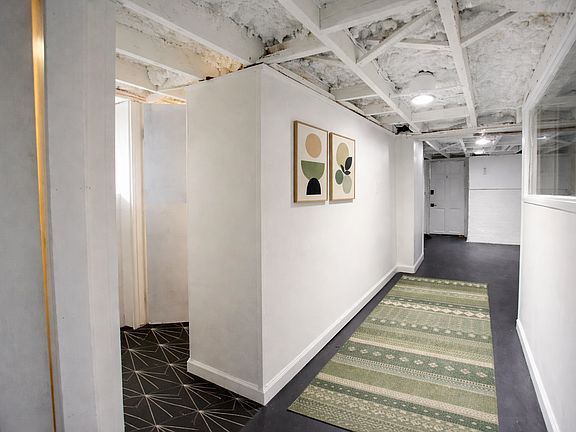 Hallway to flex room & bathroom