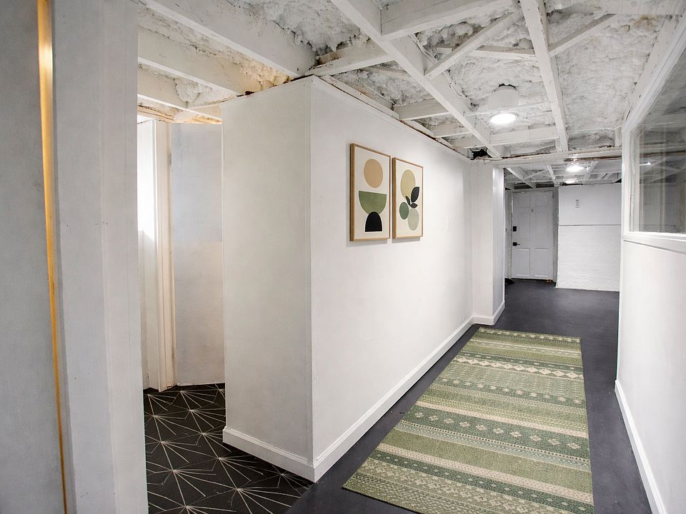 Hallway to flex room & bathroom