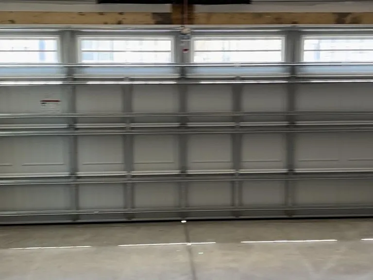 2 car garage with wifi enabled opener and entrance from alley behind home.