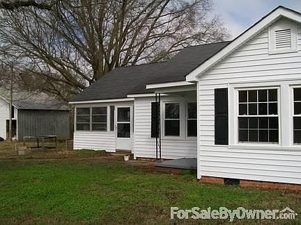 Farm House with Sun Porch
						:
						Shows outside building to left of house