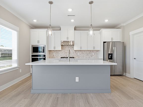 Kitchen in the Lakeland floorplan at a Meritage Homes community in Raleigh, NC.