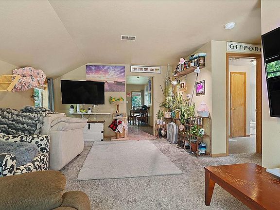 Cozy living room with new carpet, drywall and doors.