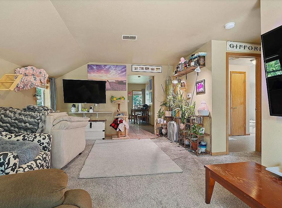 Cozy living room with new carpet, drywall and doors.