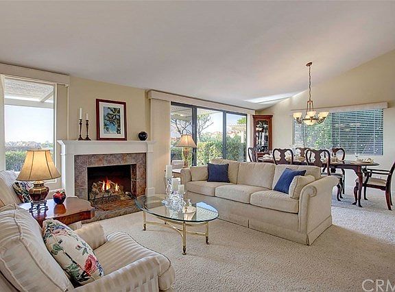 Light, bright and airy home with dramatic cathedral ceilings. End unit adds addition windows. Custom