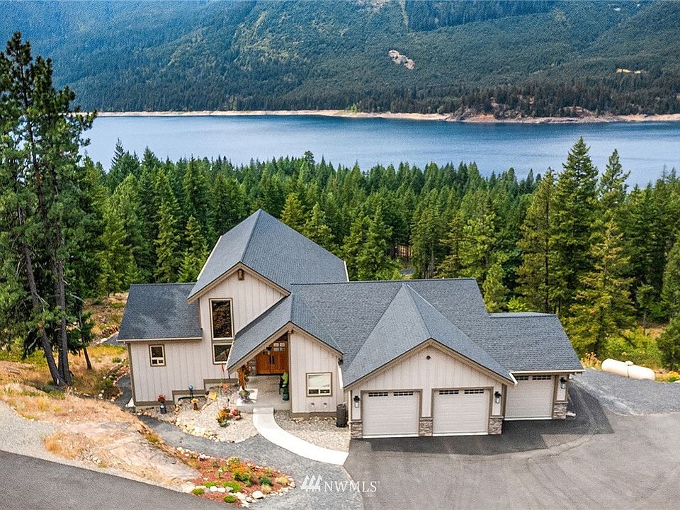 Paved community maintained road leads to this spectacular lake view mountain retreat.