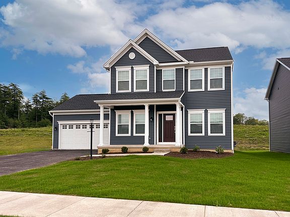 Front exterior view of the Fairmont floorplan by S A Homes - two story home with covered front porch