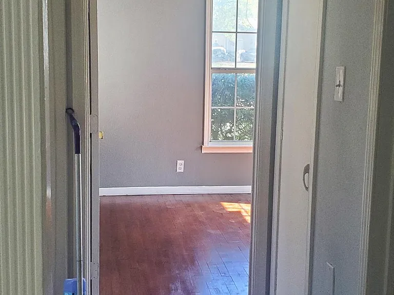 looking into the gray bedroom from living room